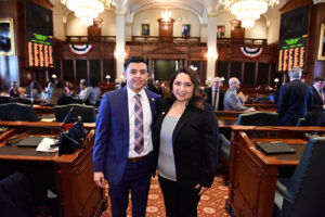 State Rep. Delia Ramirez and state Rep. Aaron Ortiz on the House floor