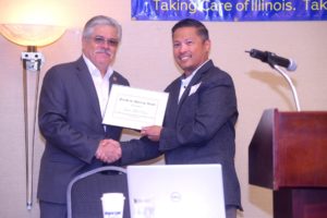 Pictured: State Rep. Crespo (left) accepting award from INA President Terence Yee (right)