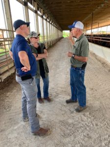 Pictured: Rep. Yednock (far left) taking a tour of the Adams’ family farm.