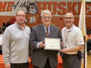 Pictured: Walker (center) presents a certificate of recognition to Hersey High School Assistant Principals Ron Kiolbassa (left) and Joe Krajacic (right) in honor of their recent naming as a top STEM school in the nation.