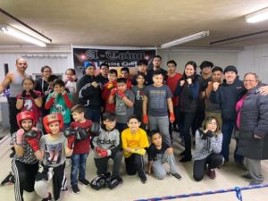 Pictured: State Rep. Barbara Hernandez with the A-Town Boxing Club students.